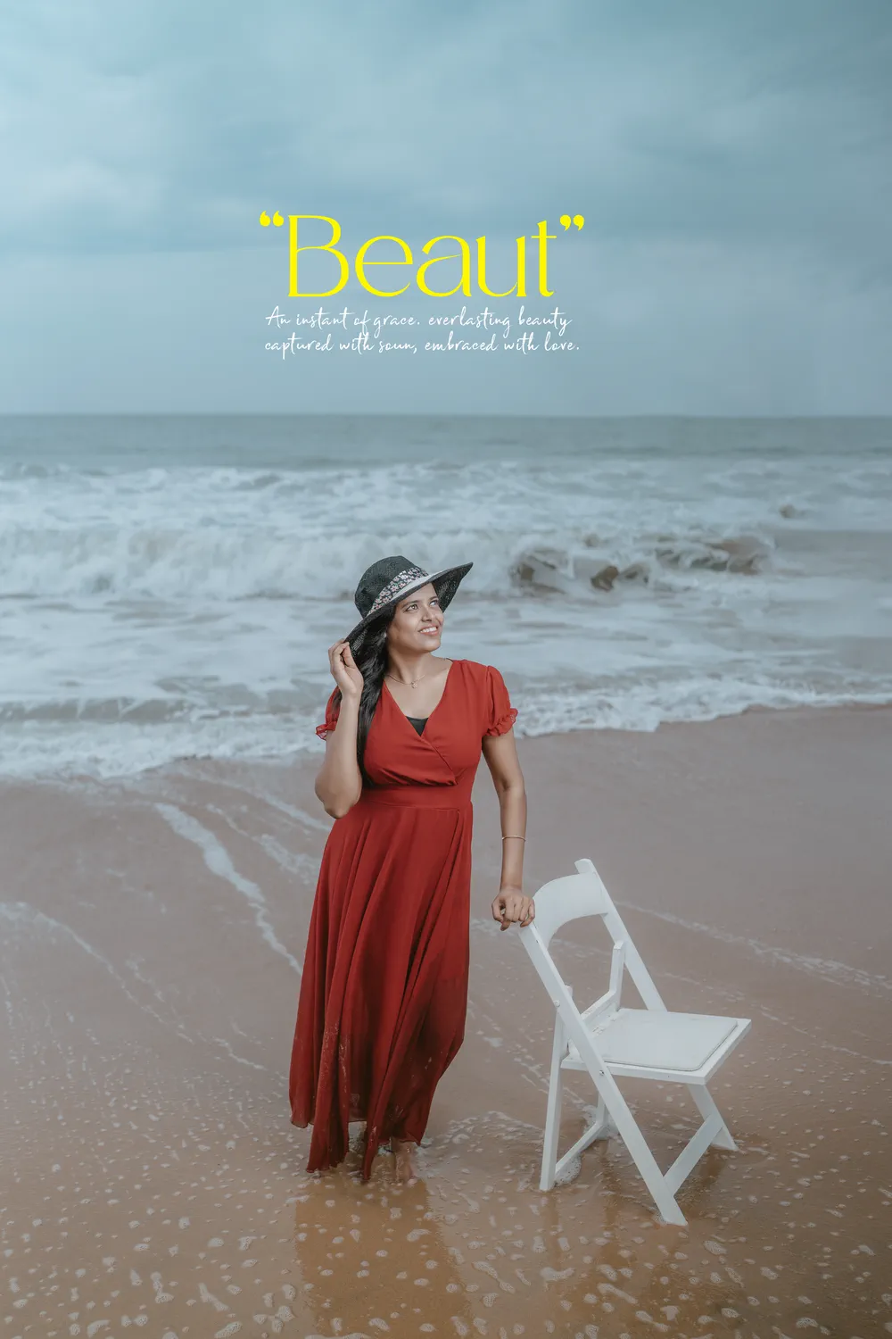 A red dress against a grey shoreline