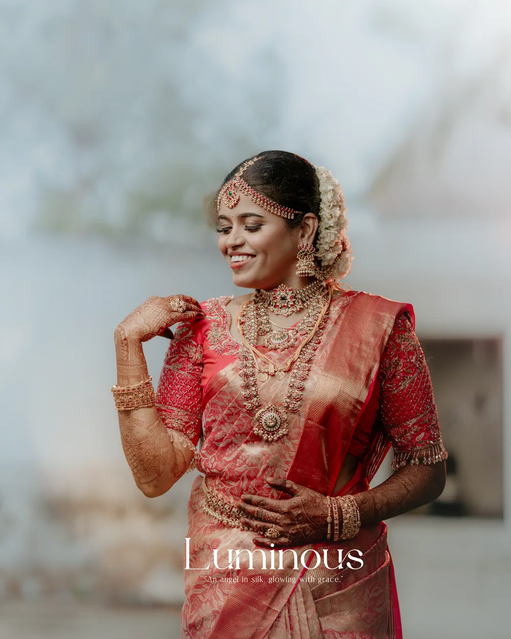 Bride in red silk, jasmine in her hair